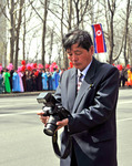 Regimfotograf i samband med paraden för Kim Jong-il's 100års födelsdag