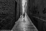 Boys exploring narrow street in Italy