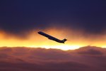 MD80 taking of in sunset